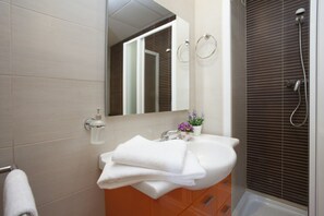 Bathtub, hair dryer, towels