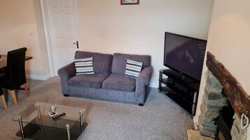 Apartment, 2 Bedrooms, Garden View | Living area | Flat-screen TV