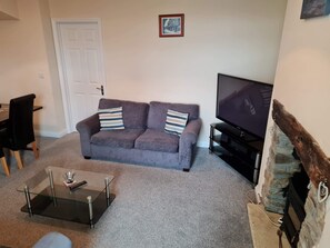 Apartment, 2 Bedrooms, Garden View | Living area | Flat-screen TV