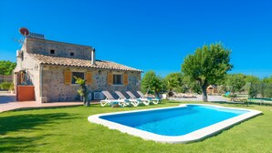 A house with a swimming pool, a garden, and a tree. - Can Roig 113 fantastic finca with private pool, garden, children's area and air-conditioning (Alcúdia)