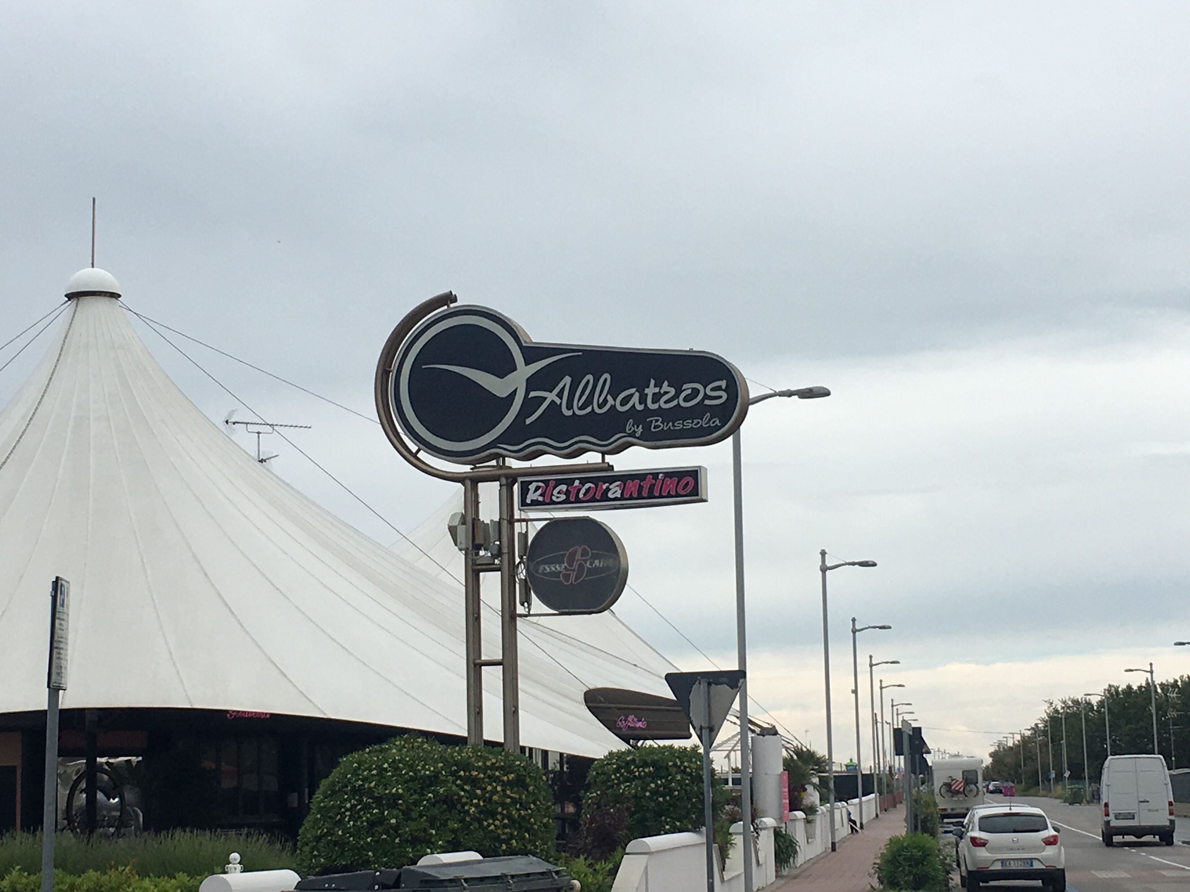 A restaurant sign for 'Albatros by Bussola' and 'Ristorante'.