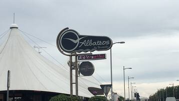 A restaurant sign for 'Albatros by Bussola' and 'Ristorante'.