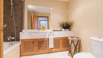 Bathtub, hair dryer, towels