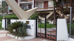 A gated entrance with a sign reading "ARMAN E1" and a number "13" sign. - See view, 500m from the beach,Aircon,WIFI,terrace (Roquetas de Mar)