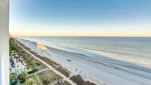 A coastal hotel with a beach view, a pool, and a boardwalk. - Camelot By the Sea 🏖️ Oceanfront 🏖️ (Myrtle Beach)