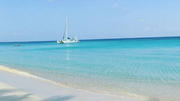 On the beach, sun loungers, beach towels