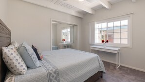 A bedroom with a bed, a desk, a window, and a ceiling fan. - Great Lantern District Location!.. Central AC!...Ocean View<br> (Dana Point)
