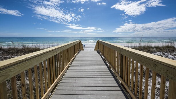 A wooden boardwalk leading to a beach with clear skies and ocean views. - BREATHTAKING VIEWS on every floor! 214 Destin Seafarer (Destin)