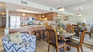 A modern kitchen with a central island, stainless steel appliances, and wooden cabinetry. - 202- Offers AMAZING GULF VIEWS from private balcony. Destin Beach Club (Destin)