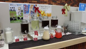 A beverage station with various drinks and a water dispenser. - FUN GATE HOTEL SAPPORO (Sapporo)