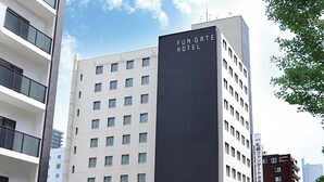 A multi-story building with a prominent sign reading "Fungate Hotel". - FUN GATE HOTEL SAPPORO (Sapporo)
