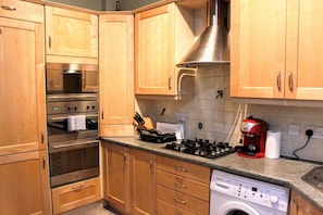 Apartment, 2 Bedrooms | Private kitchen | Fridge, oven, stovetop, dishwasher