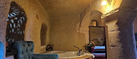 Turkuaz Cave Suit Room | Living area | 64-cm LED TV with cable channels, TV