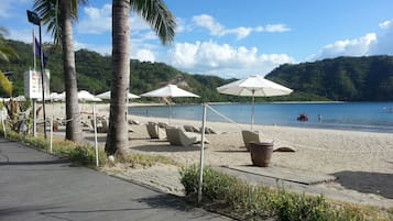 Private beach, free beach shuttle, free beach cabanas, beach umbrellas