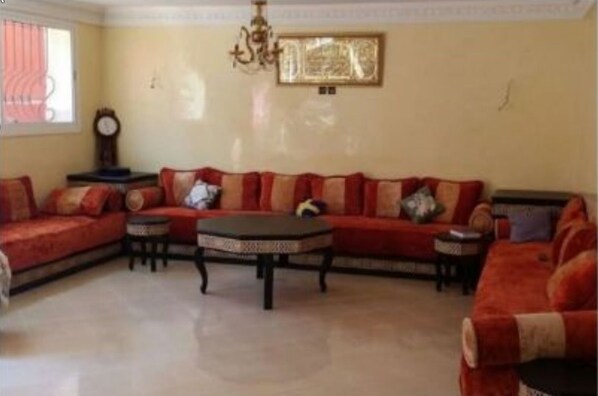 Villa | Living area | 50-inch flat-screen TV with cable channels, TV - Villa Molechat (Dar Bouazza)