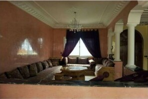 Villa | Living area | 50-inch flat-screen TV with cable channels, TV - Villa Molechat (Dar Bouazza)