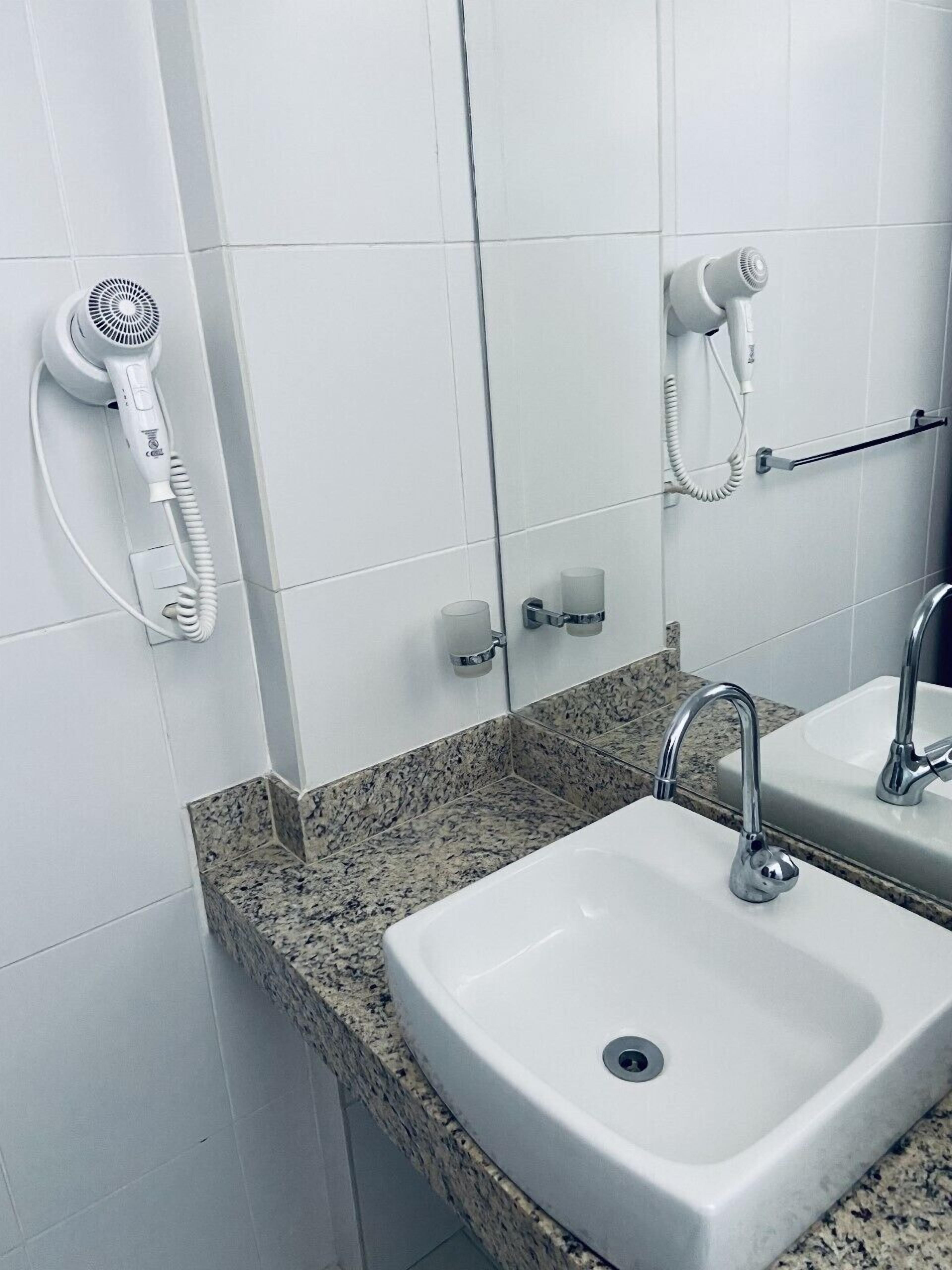 deluxe suite, city view | bathroom | designer toiletries, hair dryer, towels, soap