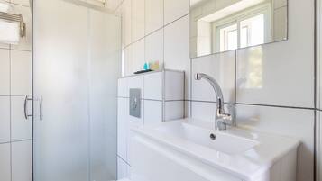 Shower, free toiletries, hair dryer, slippers