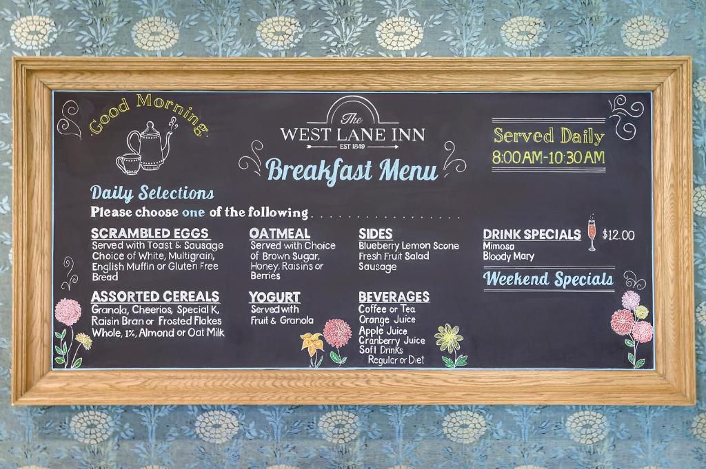 A breakfast menu at The West Lane Inn, including daily selections like scrambled eggs and oatmeal, drink specials, and weekend specials.
