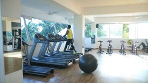 A gym with treadmills, a large exercise ball, and various fitness equipment. - Figaro Hotel Boutique (Samaná)