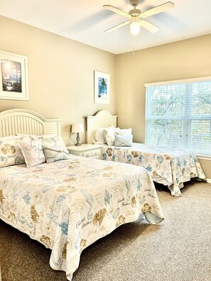 A bedroom with two beds, a ceiling fan, and a window with blinds. - Clean, Comfortable, Family Friendly Condo, EXCELLENT Location! Mins to DISNEY!!  (Kissimmee)