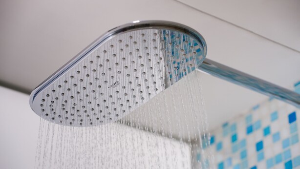 A showerhead with water flowing from it. - Summit View Kowloon (Kowloon)