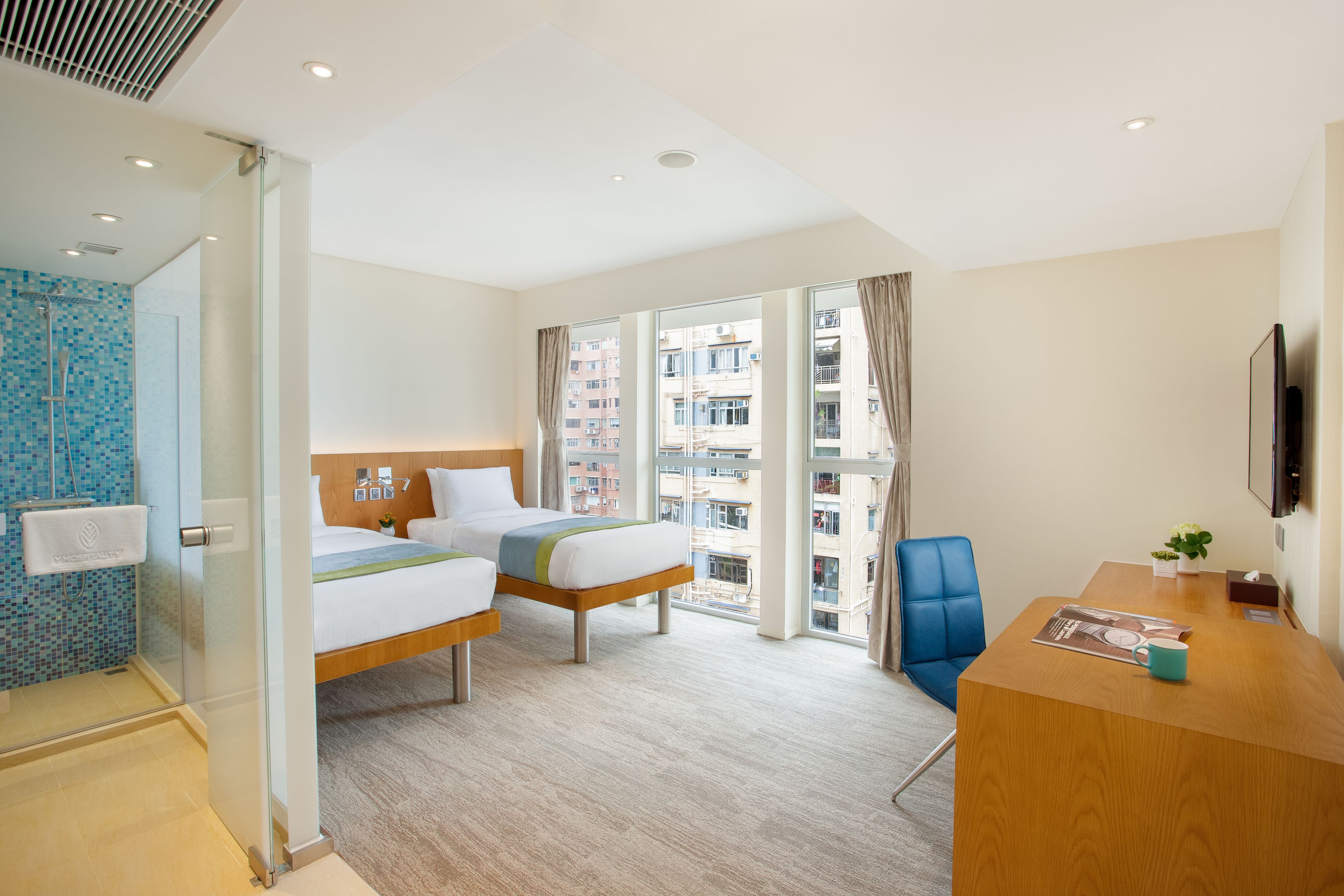 grand premier twin bed room (one registered guest must be female) | down duvets, in-room safe, desk, blackout curtains