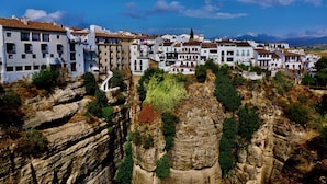 A coastal town with white buildings, rocky cliffs, and a clear blue sky. - Four Storey Finca  Infinity Pool Mountain Views optional separate apartment  (Malaga Province)