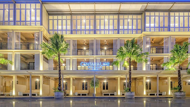 A multi-story hotel with a sign reading 'CENTRAL LIFE' and a pool area in front. - Holiday Park Hotel (Koh Samui)