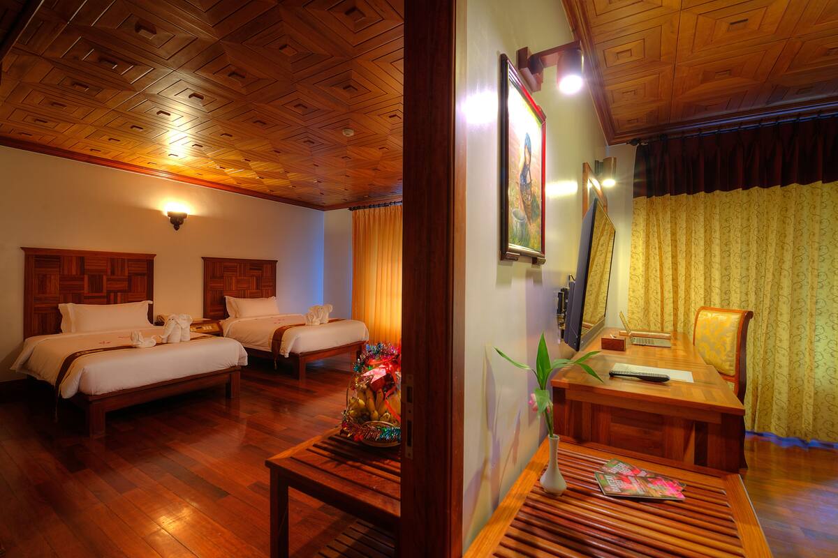 Family Suite, 3 Bedrooms, Pool View | Minibar, in-room safe, desk, iron/ironing board