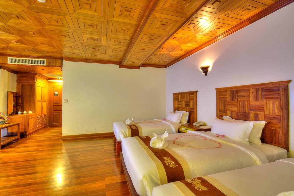 Deluxe Triple Room, 3 Bedrooms, City View | Minibar, in-room safe, desk, iron/ironing board