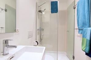 Shower, hair dryer, towels, soap