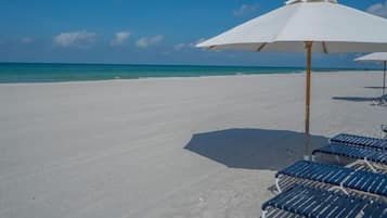 On the beach, sun loungers, beach towels