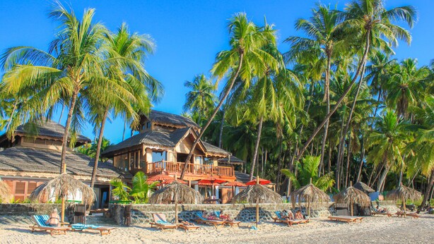 A beachfront property with multiple rooms, a pool area, and palm trees. - Yoma Cherry Lodge (Ngapali)
