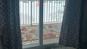A room with a view of the ocean through a sliding glass door. - Remodeled 2020  Gulf front Private condo (Santa Rosa Beach)