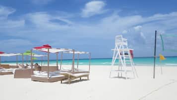 On the beach, sun loungers, beach towels