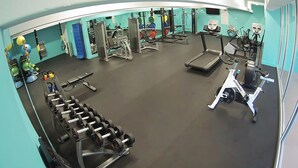 A gym with various exercise equipment, including treadmills, weight machines, and free weights. - Top Floor, Corner 2 Bedroom, Ocean View, Beach Cabana, 3 pools, Jacuzzi. (Kaanapali)