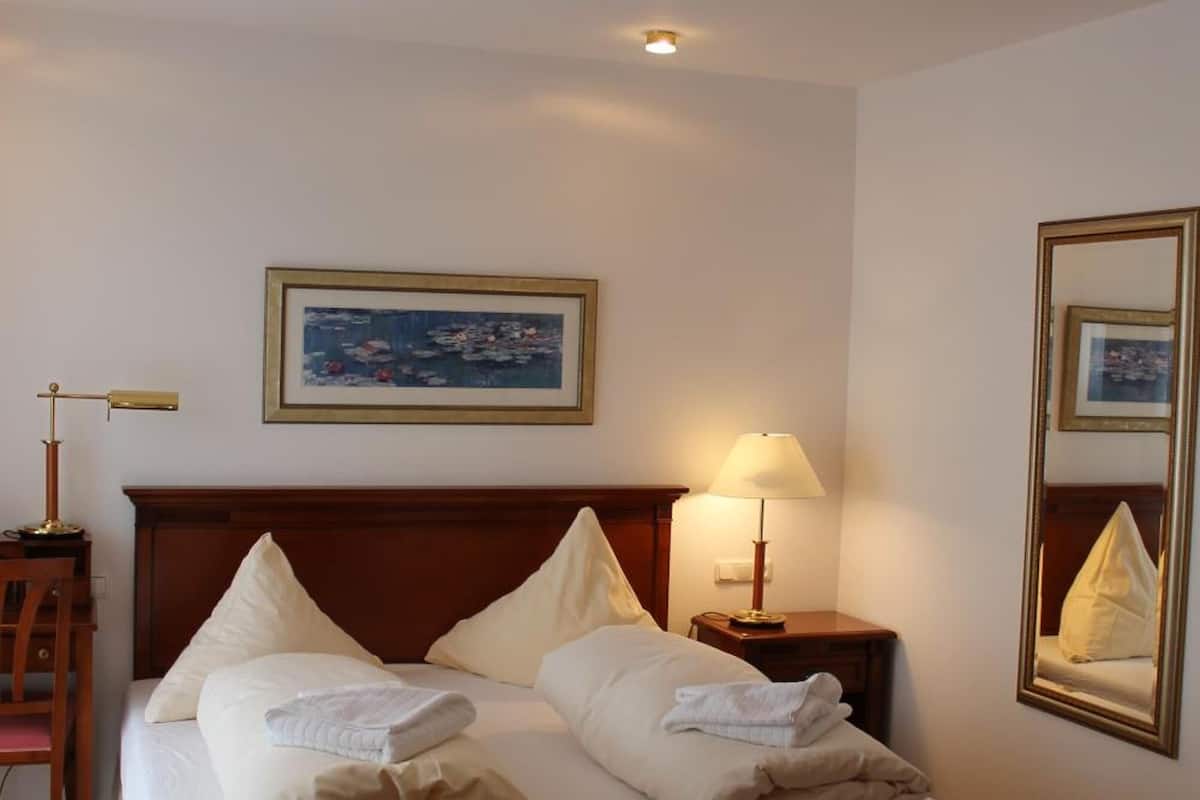 iron/ironing board, cots/infant beds, free wifi, bed sheets