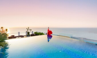 Outdoor pool, open 6 AM to 10:00 PM, pool umbrellas, sun loungers