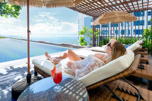 Outdoor pool, open 6 AM to 10:00 PM, pool umbrellas, sun loungers