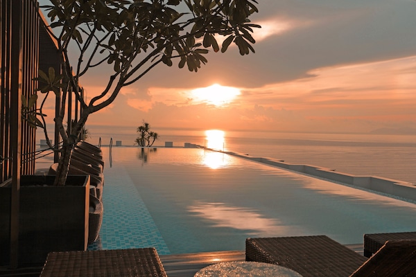 Outdoor pool, open 6 AM to 10:00 PM, pool umbrellas, sun loungers