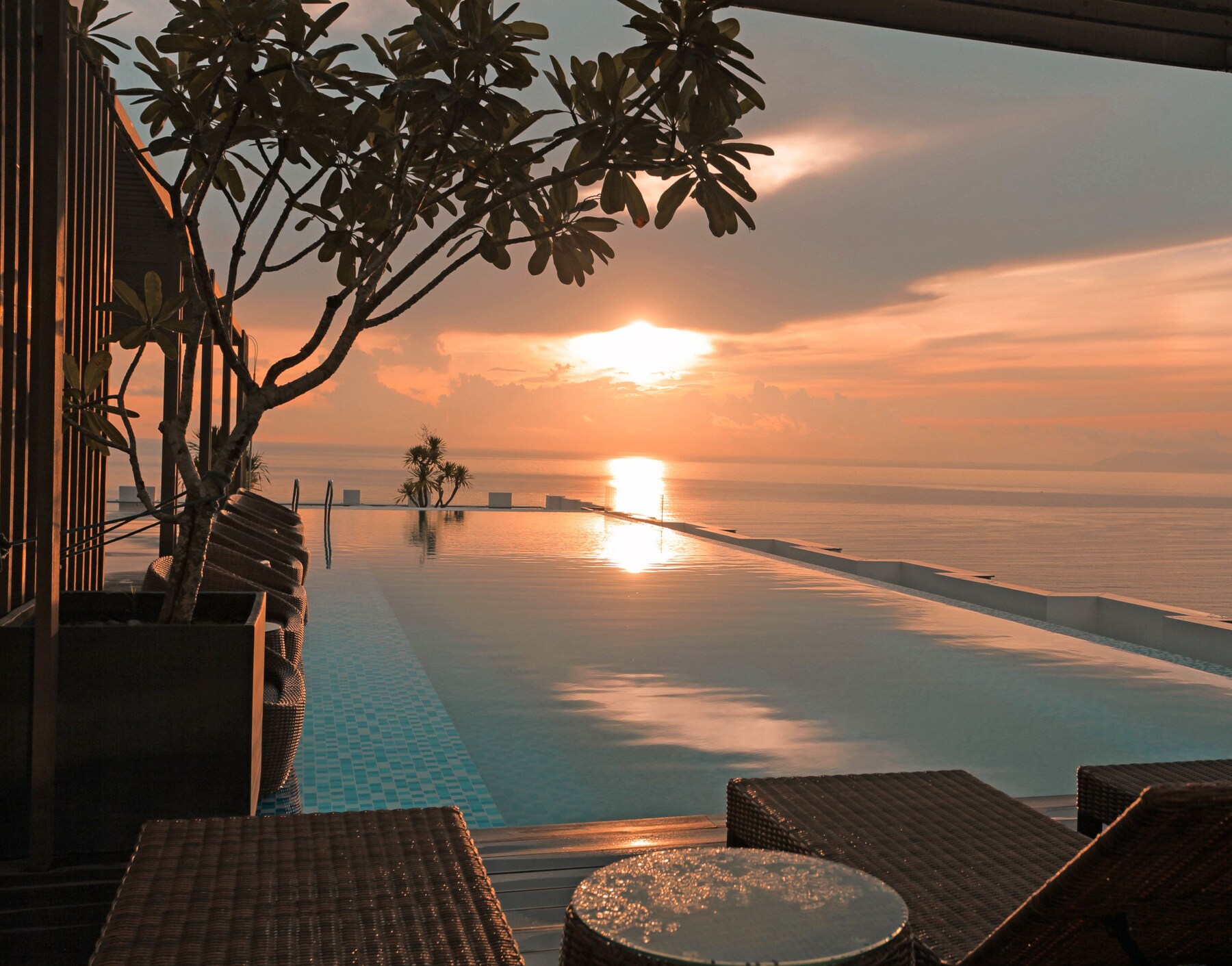 Outdoor pool, open 6 AM to 10:00 PM, pool umbrellas, pool loungers