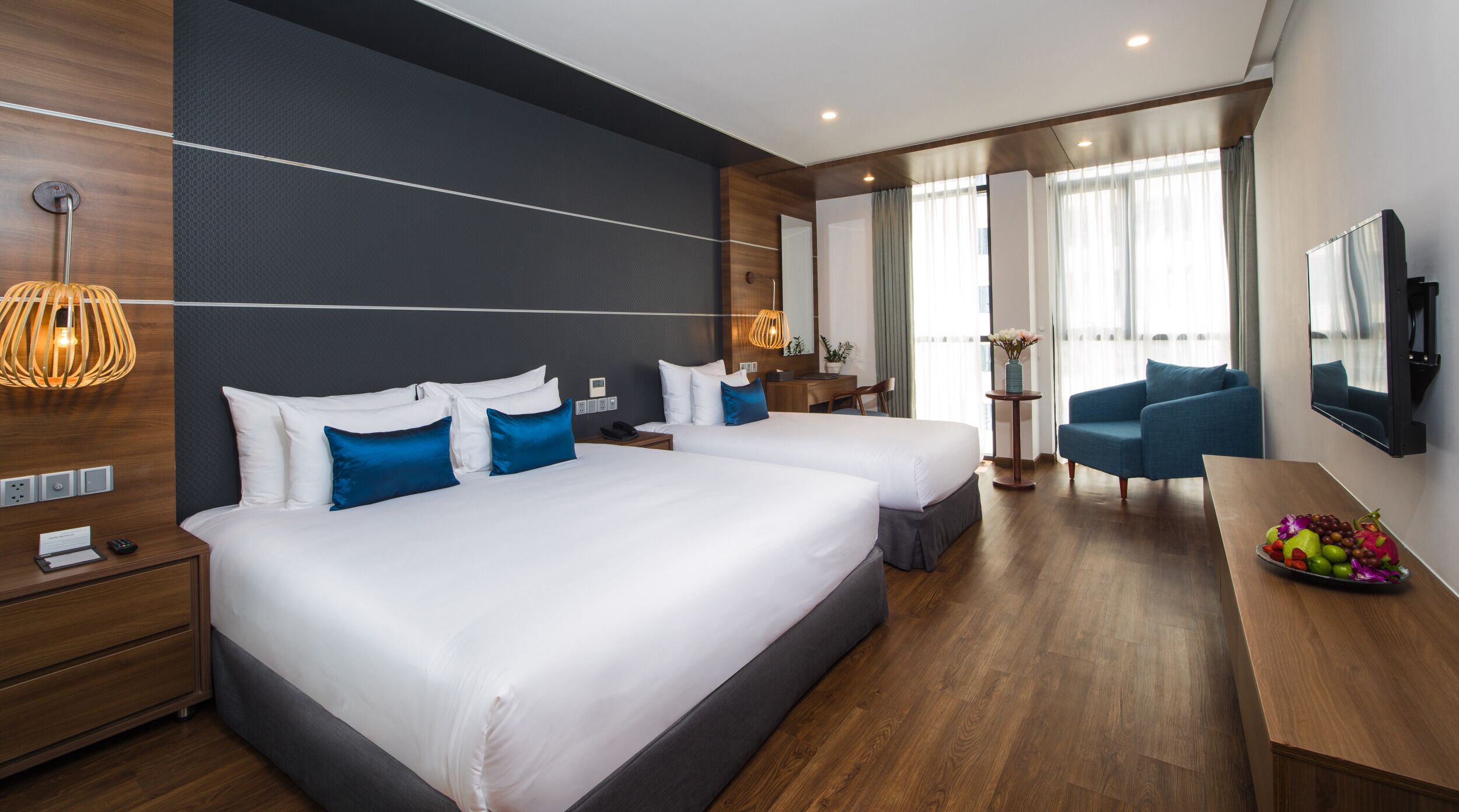 Superior Triple Room | Minibar, in-room safe, desk, laptop workspace