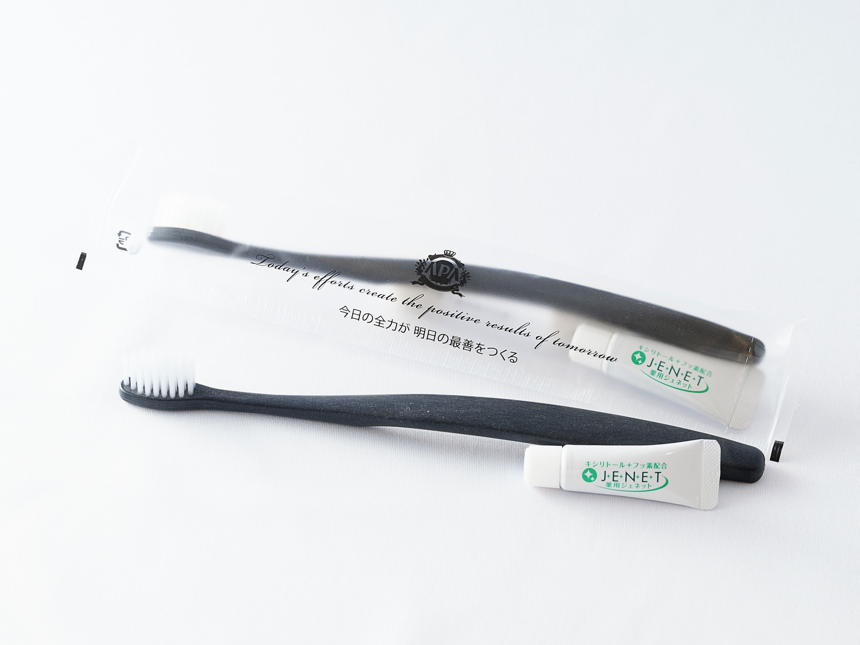 Two toothbrushes with packaging.