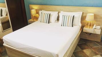 Minibar, desk, bed sheets