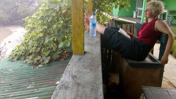 A person sitting on a bench with a water bottle.