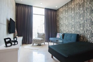 Apartment, 3 Bedrooms | Living area | Flat-screen TV