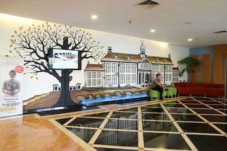 Lobby sitting area. Arcadia Mangga Dua by Horison