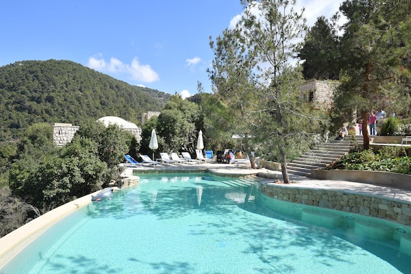 2 outdoor pools, an infinity pool, pool loungers