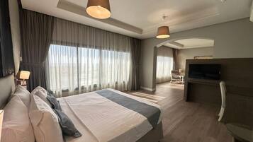 Apartment, 1 Bedroom, Sea View | In-room safe, soundproofing, iron/ironing board, free WiFi